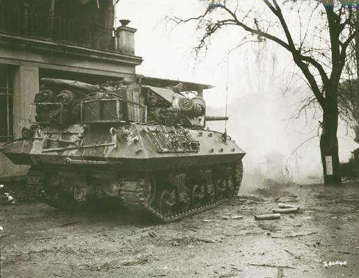 A U.S. Army M10 tank destroyer firing across a river in France in early 1945, the same type of vehicle Murphy used alone at Holtzwihr