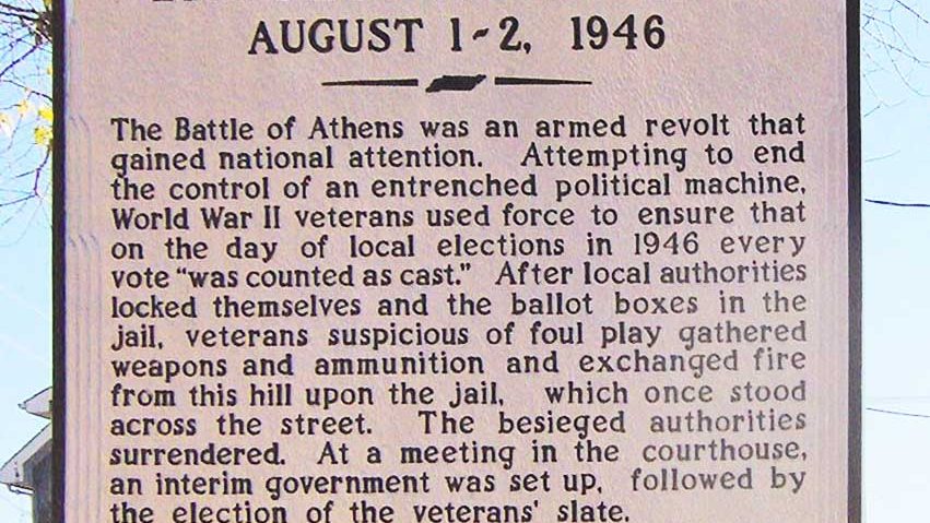 Tennessee Historical Commission marker in Athens, Tennessee, describing the 1946 Battle of Athens, photographed from the hill where the veterans took up position overlooking the old jail
