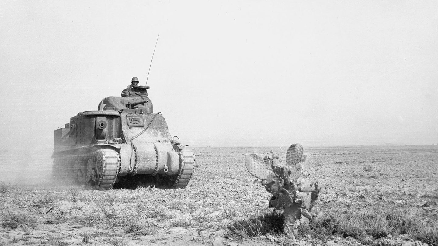 A U.S. Army M3 Grant tank of the 1st Armored Division advancing to support American forces during the fighting at Kasserine Pass, Tunisia, in 1943