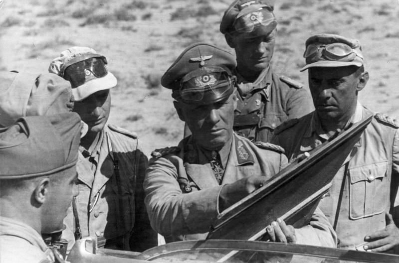 Erwin Rommel standing with staff officers in North Africa on 21 June 1942, in a photograph taken by a German army propaganda company