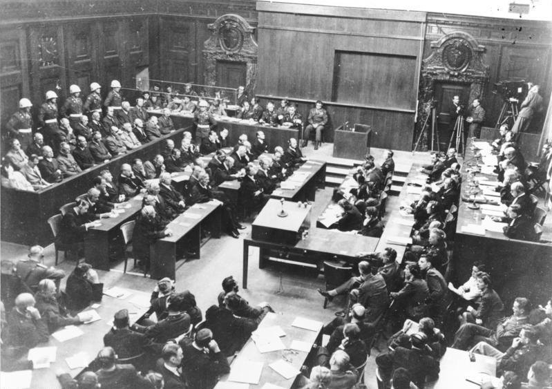 Black-and-white photograph of the International Military Tribunal courtroom at Nuremberg on September 30, 1946, showing the row of Nazi defendants, including Hermann Göring, seated on the left facing the judges