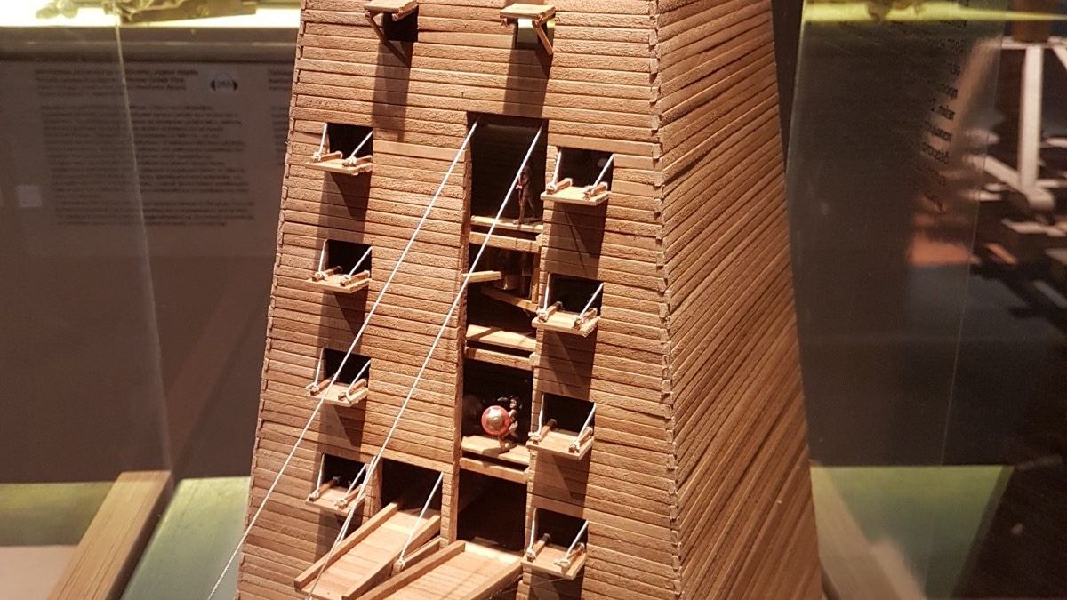 A modern museum reconstruction model of the Helepolis siege tower on display at the Kotsanas Museum of Ancient Greek Technology in Thessaloniki