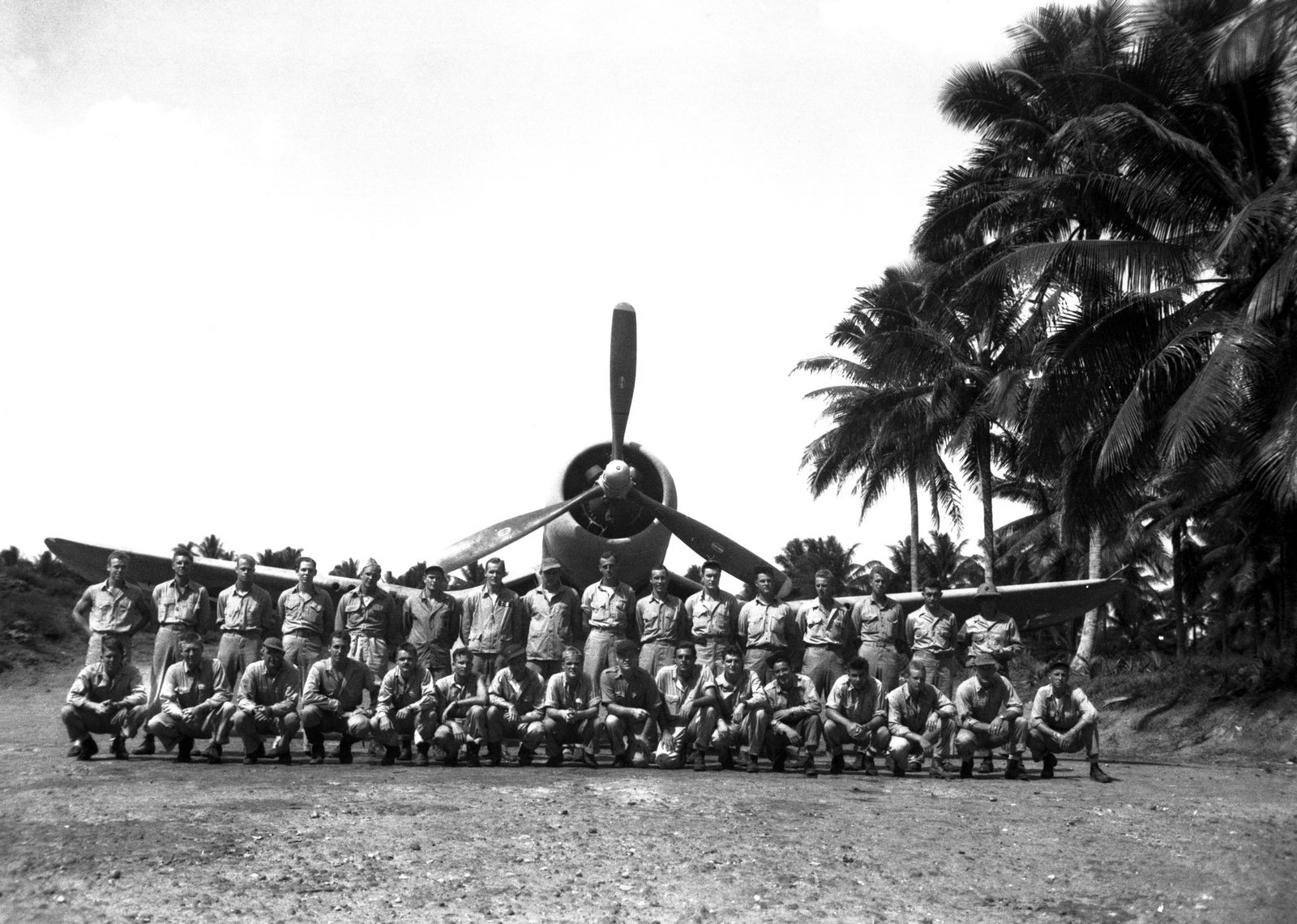 VMF-214 'Black Sheep' squadron members posing for a group photo at Turtle Bay fighter strip, Espiritu Santo, before deploying forward in September 1943